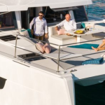 Bali 4.2 at anchor with women enjoying the foredeck