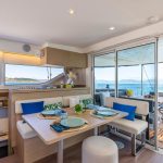 Warm and spacious salon of the Lagoon 43 sailing catamaran