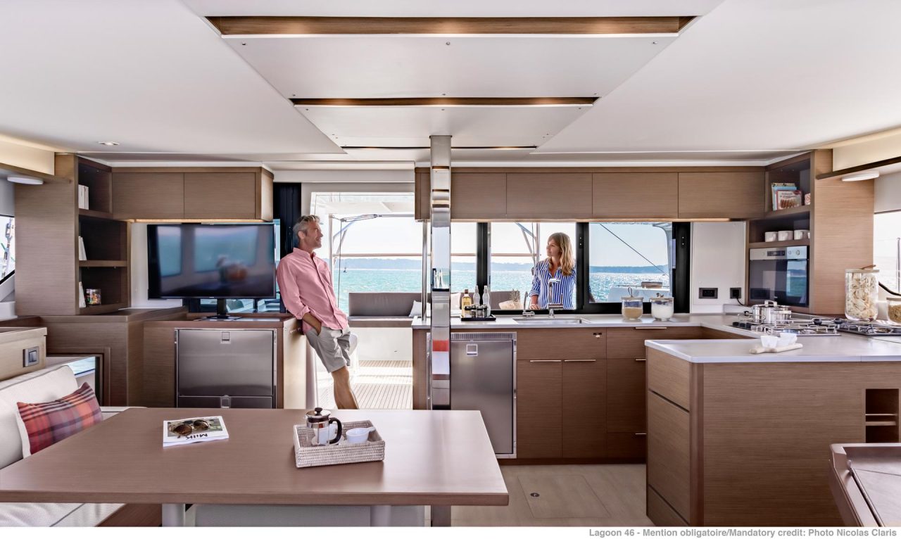 Through view of the spacious Lagoon 46 interior with the salon, the kitchen and the cockpit