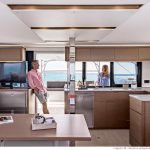 Through view of the spacious Lagoon 46 interior with the salon, the kitchen and the cockpit