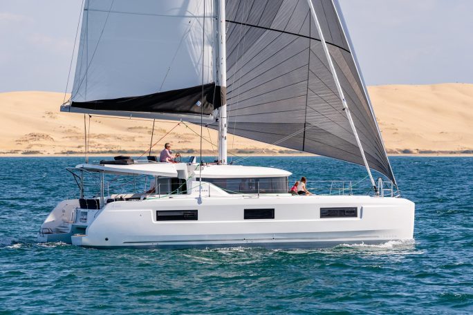 Side view of the Lagoon 46 sailing catamaran underway