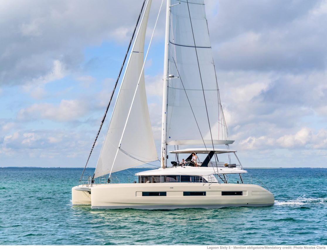 Lagoon Sixty 5 sailing with a couple at the helm