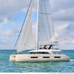 Lagoon Sixty 5 sailing with a couple at the helm