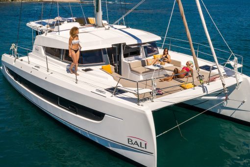 Bali 4.2 at anchor with women enjoying the foredeck