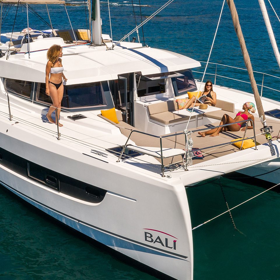Bali 4.2 at anchor with women enjoying the foredeck