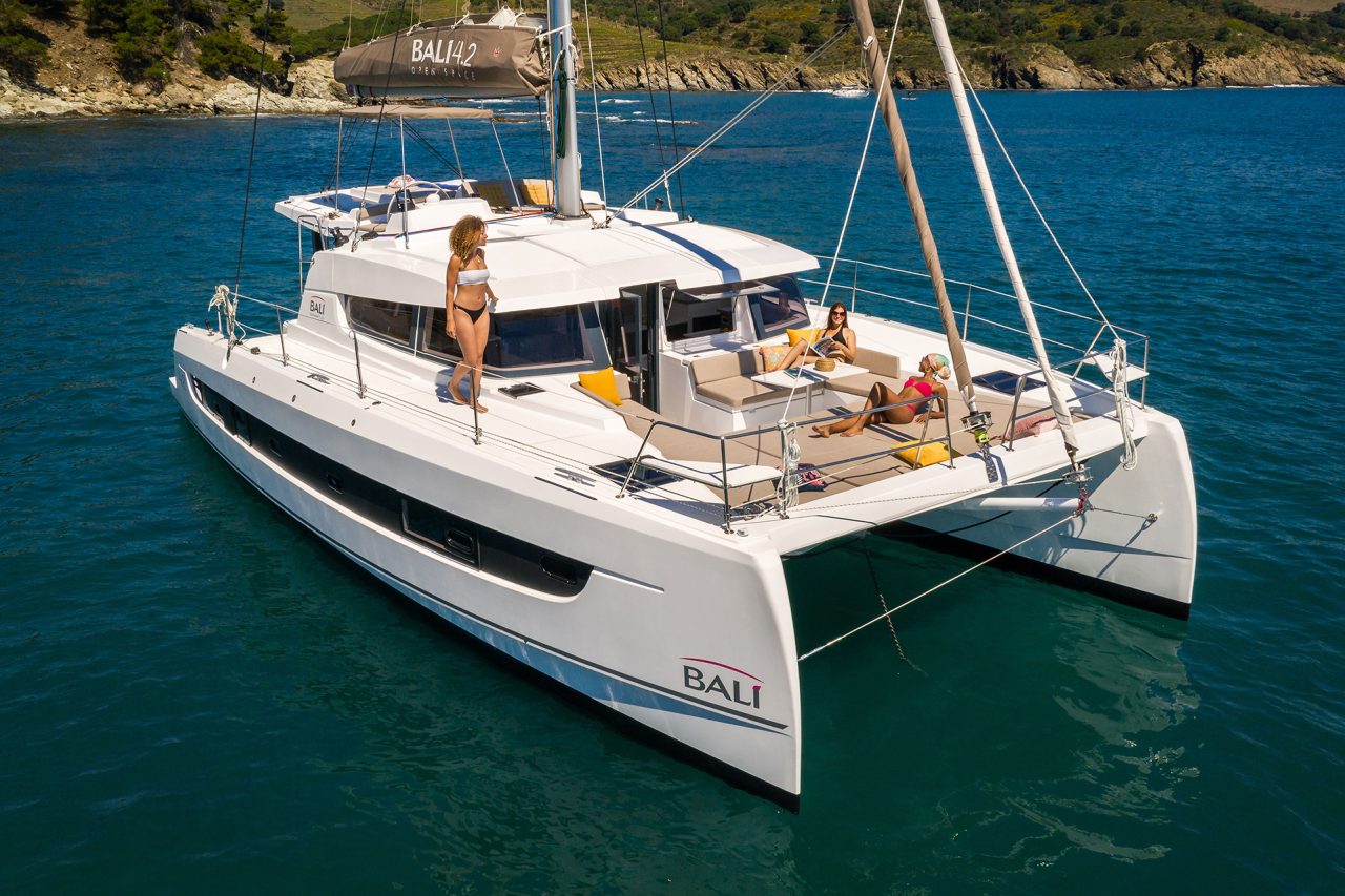 Bali 4.2 at anchor with women enjoying the foredeck