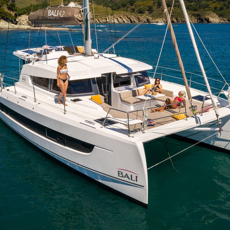 Bali 4.2 at anchor with women enjoying the foredeck