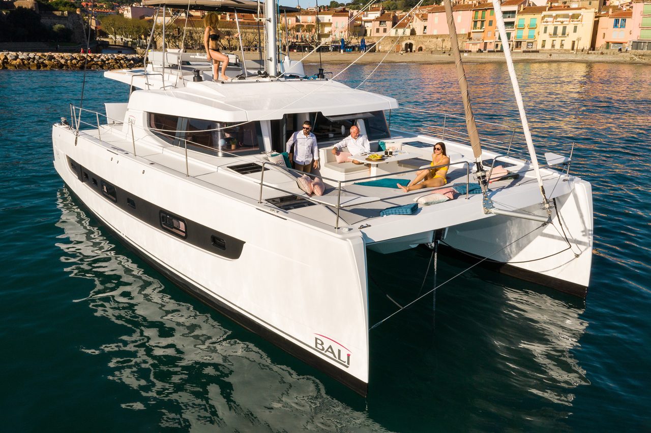 Bali 4.6 at anchor with guests enjoying the comfortable foredeck