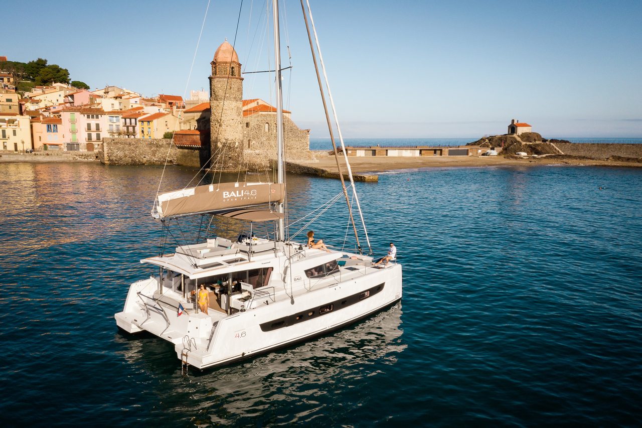 Bali 4.6 at anchor with guests enjoying the comfortable foredeck, the cockpit and the flybridge