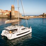 Bali 4.6 at anchor with guests enjoying the comfortable foredeck, the cockpit and the flybridge
