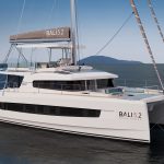 Front view of the Bali 5.2 sailing catamaran at anchor
