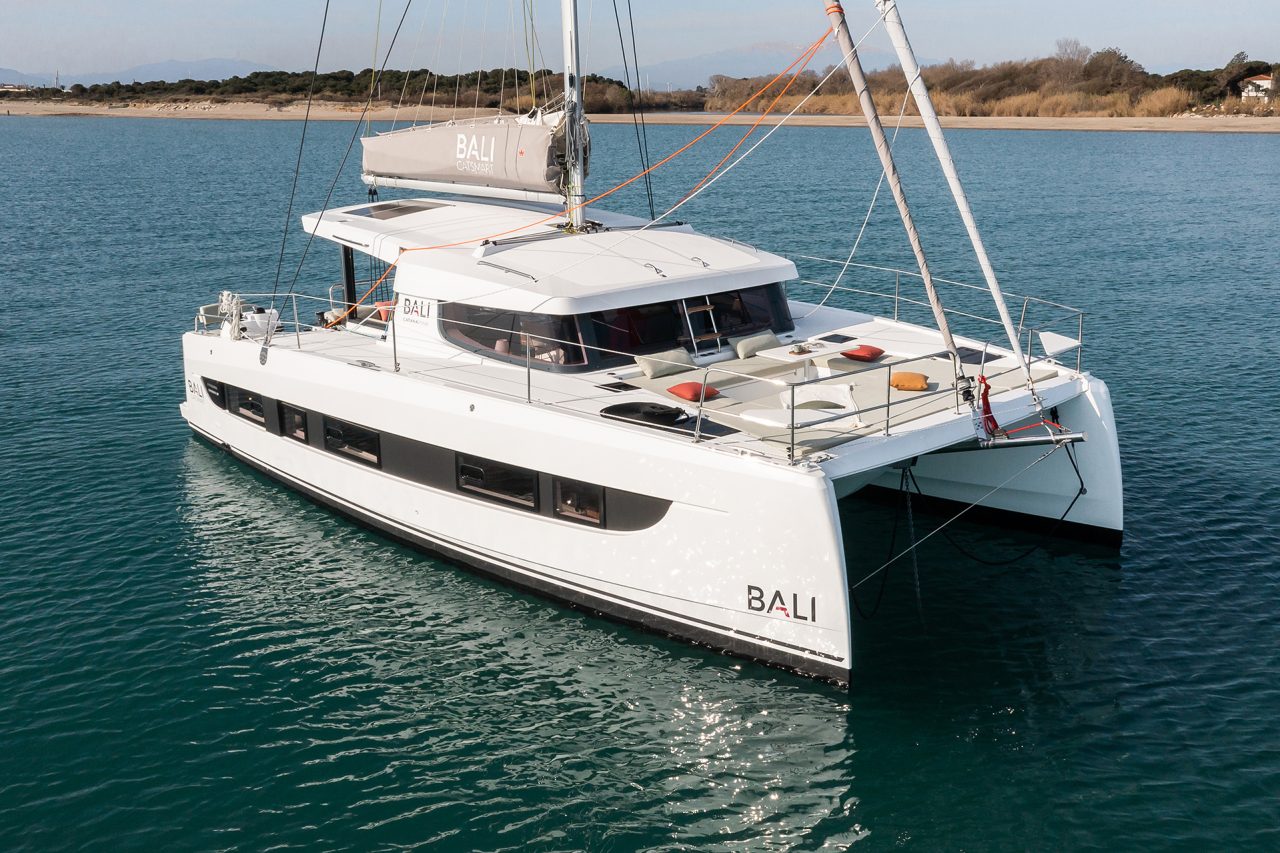 Beautiful Bali Catspace at anchor near a beach