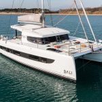 Beautiful Bali Catspace at anchor near a beach