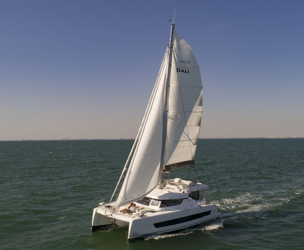 Bali Catspace sailing with guests enjoying the foredeck