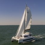 Bali Catspace sailing with guests enjoying the foredeck