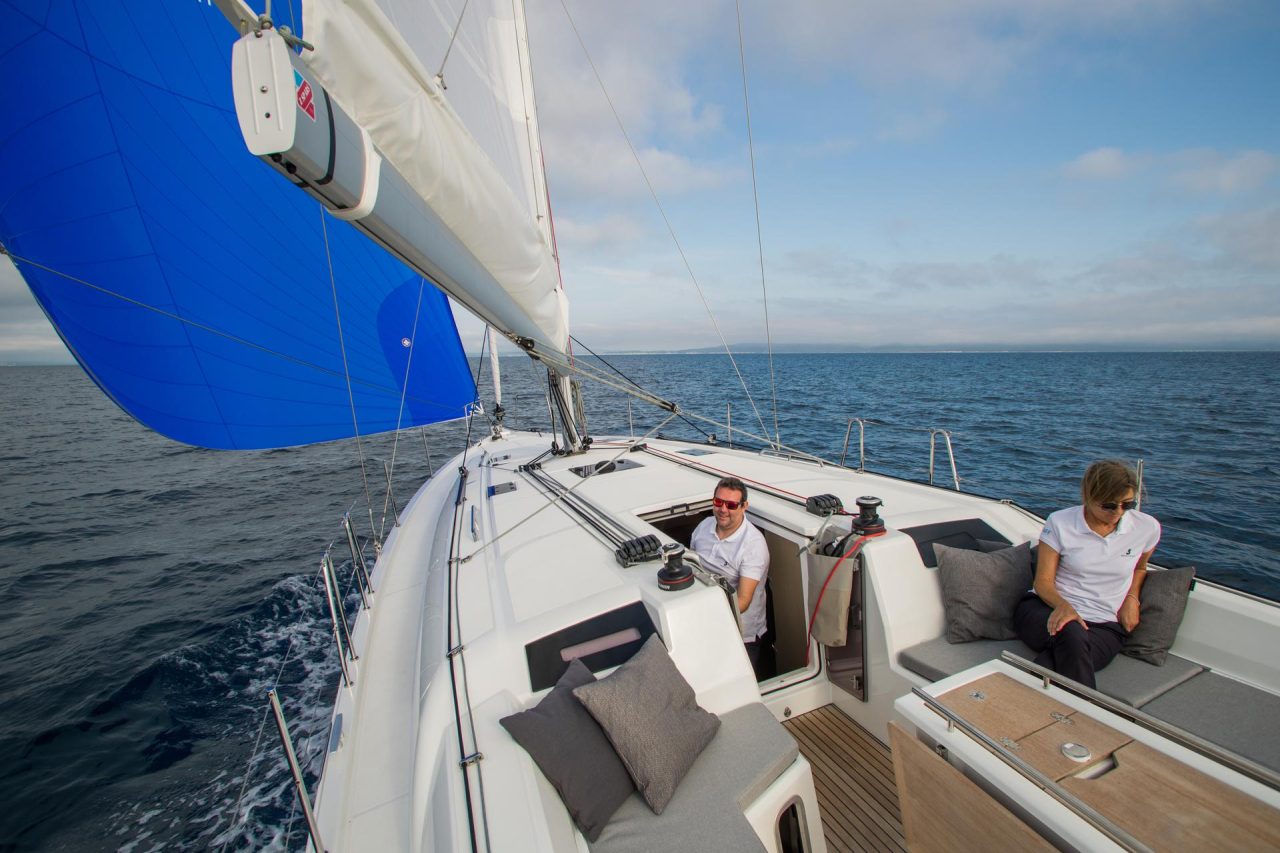 Beneteau Oceanis 40.1 sailing with a man at the helm