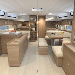 Through view of the Beneteau Oceanis 52 interior with the galley and the salon