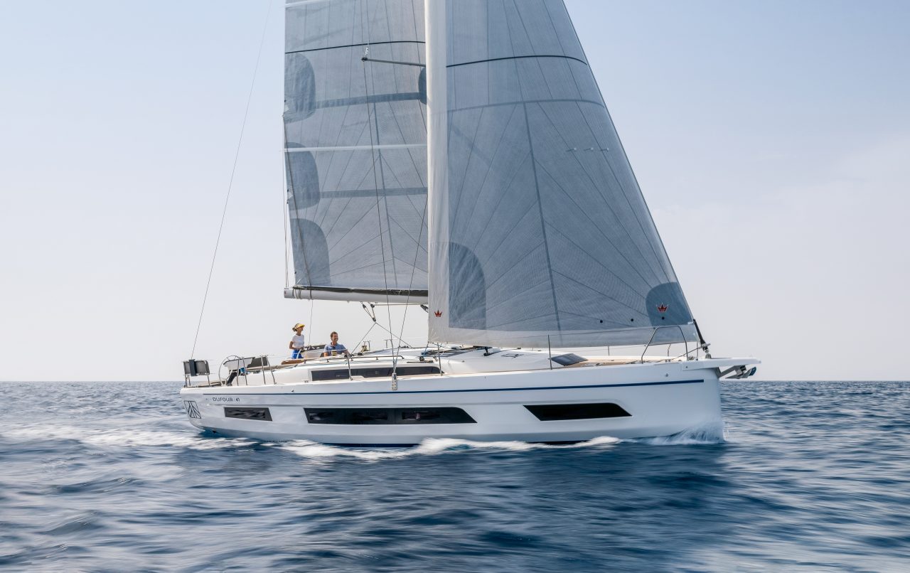 Dufour 41 sailing with a woman at the helm