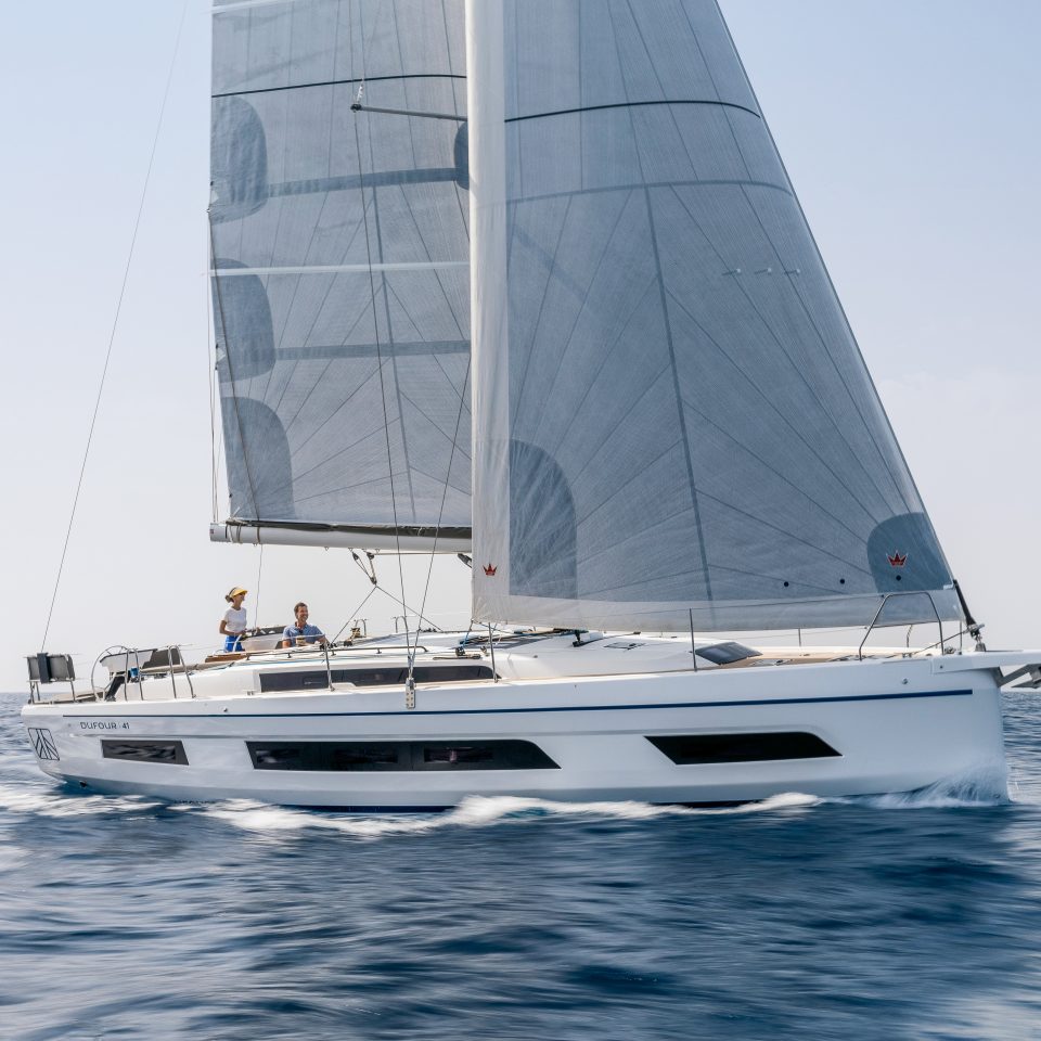 Dufour 41 sailing with a woman at the helm