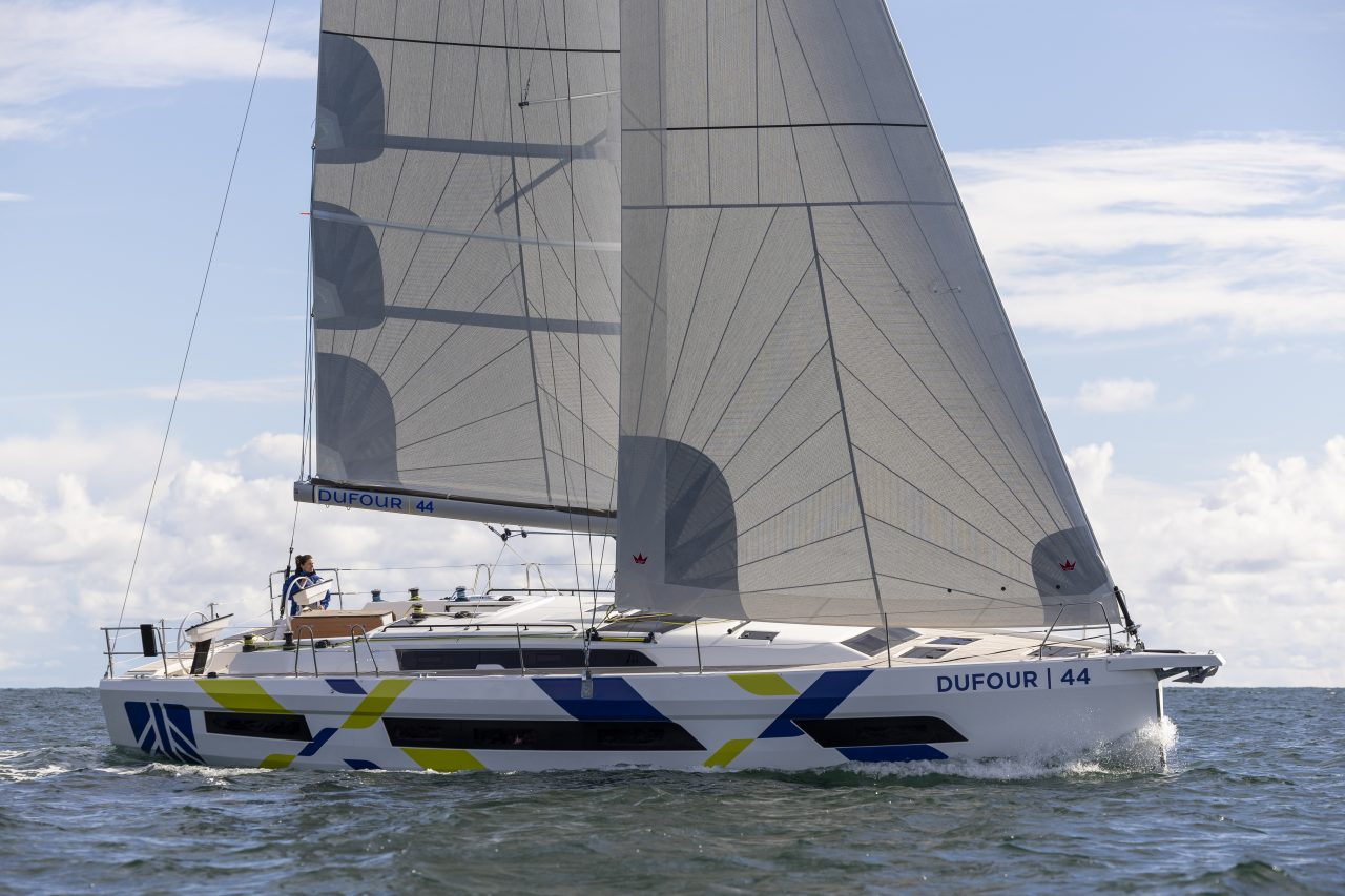 Dufour 44 sailing with a woman at the helm