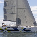 Dufour 44 sailing with a woman at the helm