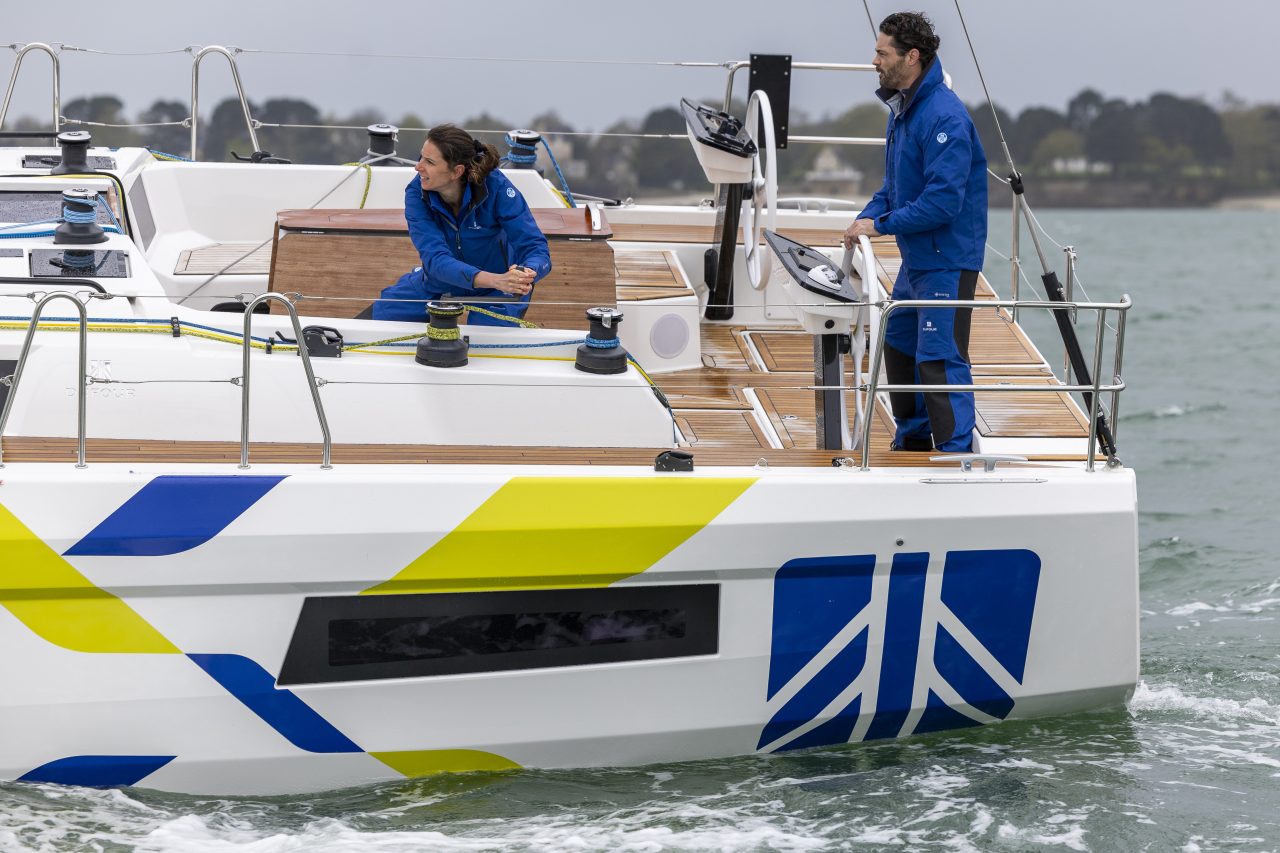 Dufour 44 at anchor with women enjoying the several decks