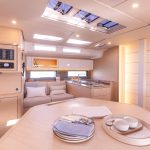 Through view of the Dufour 48 interior with the saloon and the galley