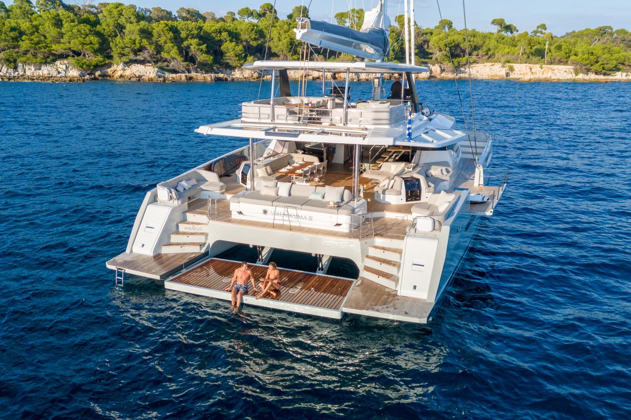 Fountaine Pajot Thira 80 sailing with a couple on the foredeck