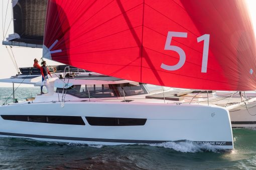 Fountaine Pajot Aura 51 sailing with a man at the helm