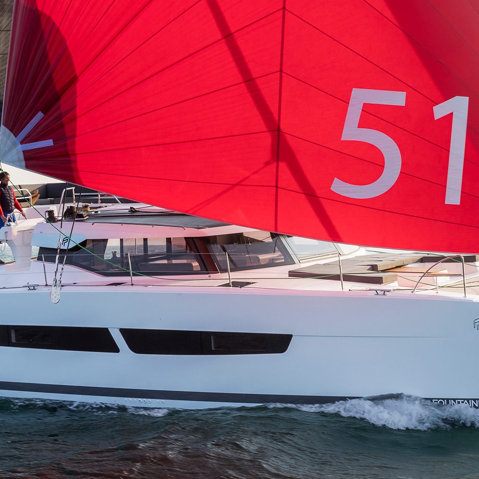 Fountaine Pajot Aura 51 sailing with a man at the helm