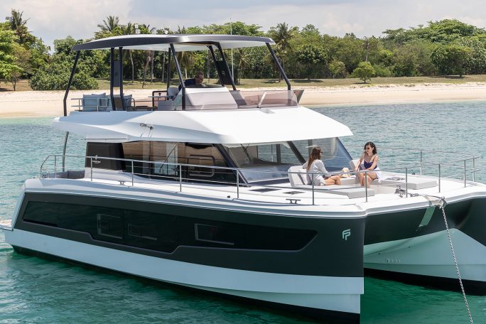 Fountaine Pajot MY5 at anchor with women enjoying the foredeck