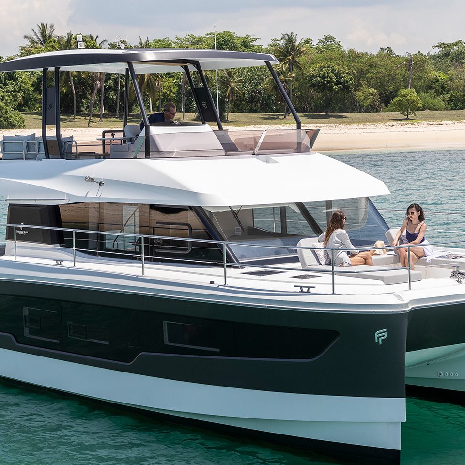 Fountaine Pajot MY5 at anchor with women enjoying the foredeck