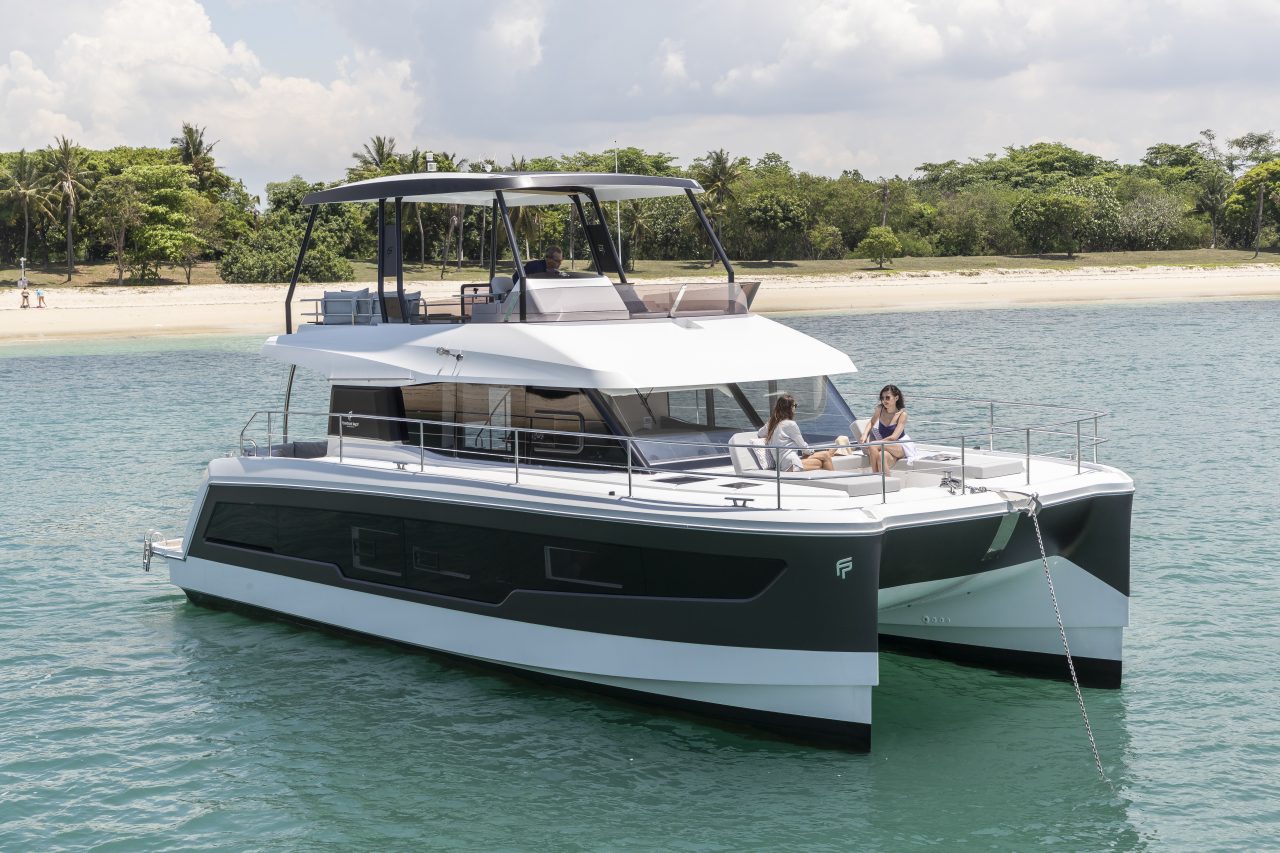 Fountaine Pajot MY5 at anchor with women enjoying the foredeck