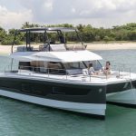 Fountaine Pajot MY5 at anchor with women enjoying the foredeck