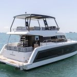 Fountaine Pajot MY5 at anchor with women enjoying the foredeck