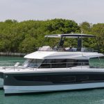Fountaine Pajot MY5 at anchor with women enjoying the foredeck