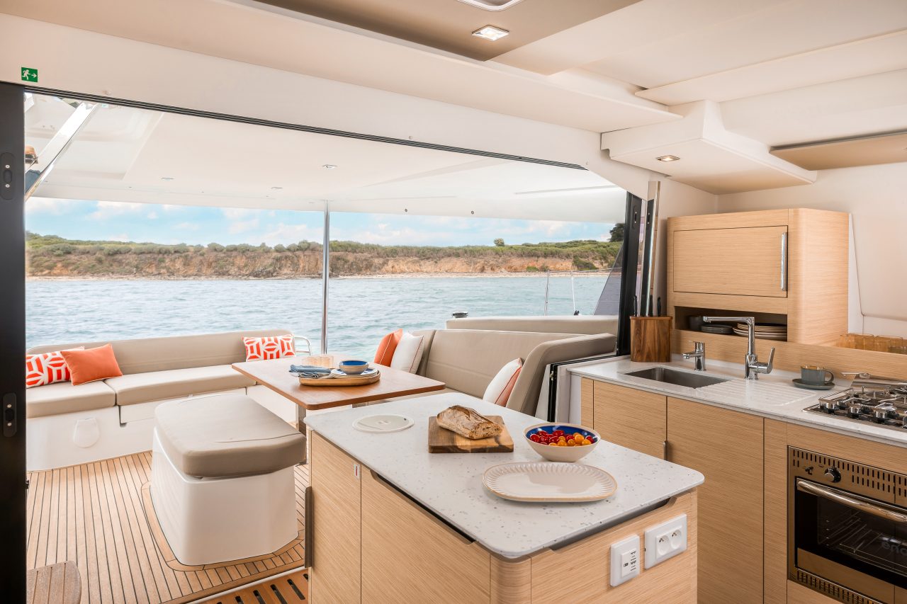 Family having lunch in the comfortabFountaine Pajot NEW 41 sailing catamaran