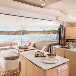 Family having lunch in the comfortabFountaine Pajot NEW 41 sailing catamaran