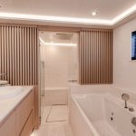 Large bathroom of a suite aboard the Fountaine Pajot Thira 80 sailing catamaran