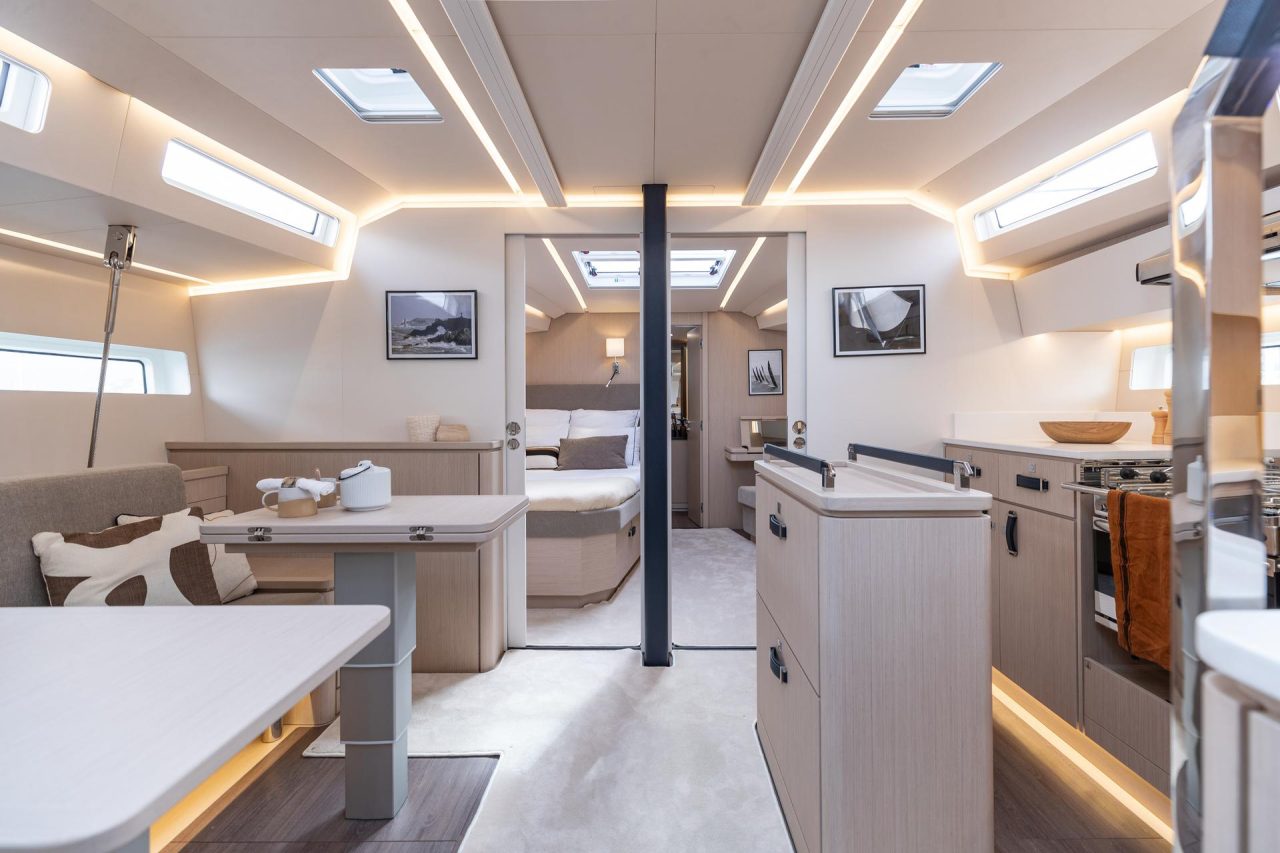 Through view of the Jeanneau 55 interior with the salon, kitchen and cabins