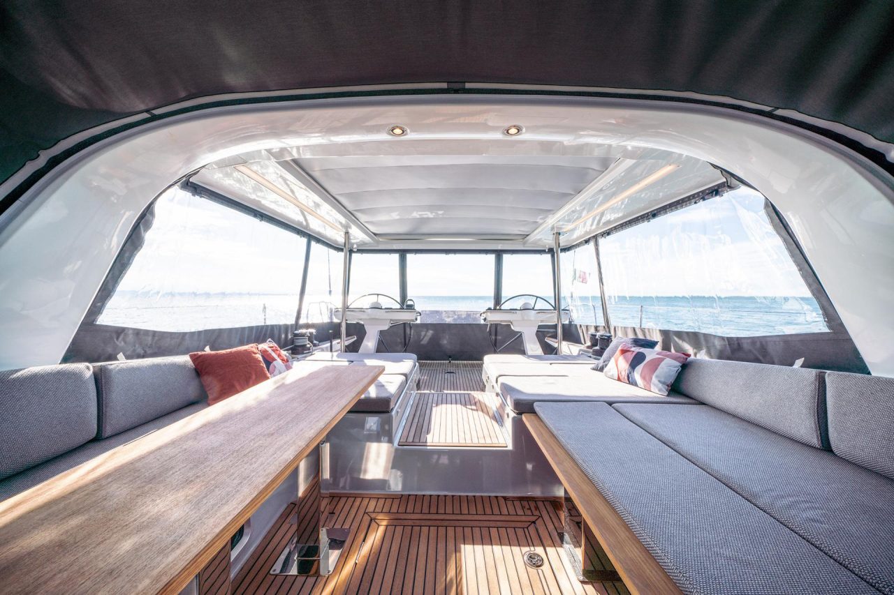 Through view of the comfortable cockpit of the Jeanneau Yacht 65 sailing monohull