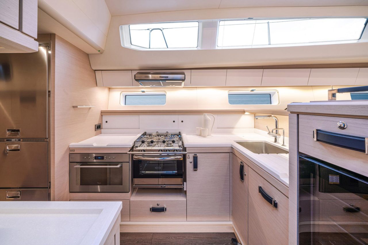 Fully equiped kitchen aboard the Jeanneau Yacht 65 sailing monohull