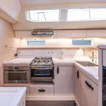 Fully equiped kitchen aboard the Jeanneau Yacht 65 sailing monohull