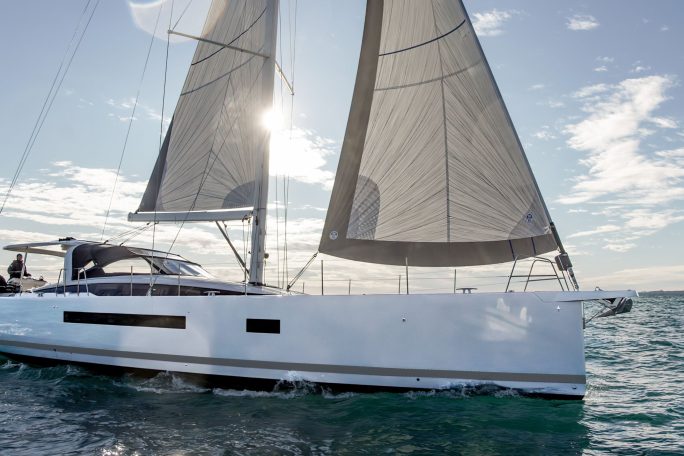 Jeanneau Yacht 65 sailing with a man at the helm