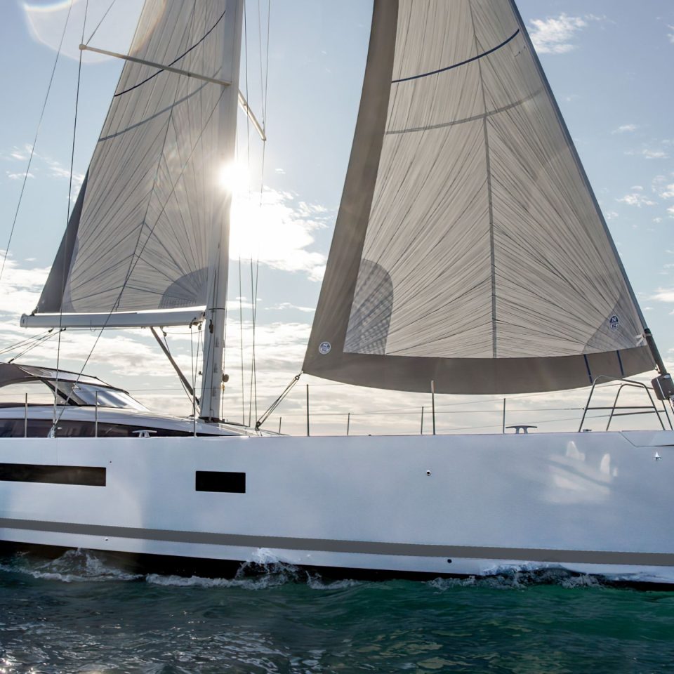 Jeanneau Yacht 65 sailing with a man at the helm