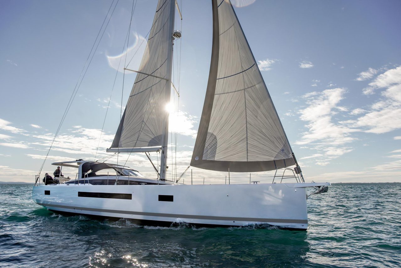Jeanneau Yacht 65 sailing with a man at the helm