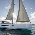 Jeanneau Yacht 65 sailing with a man at the helm