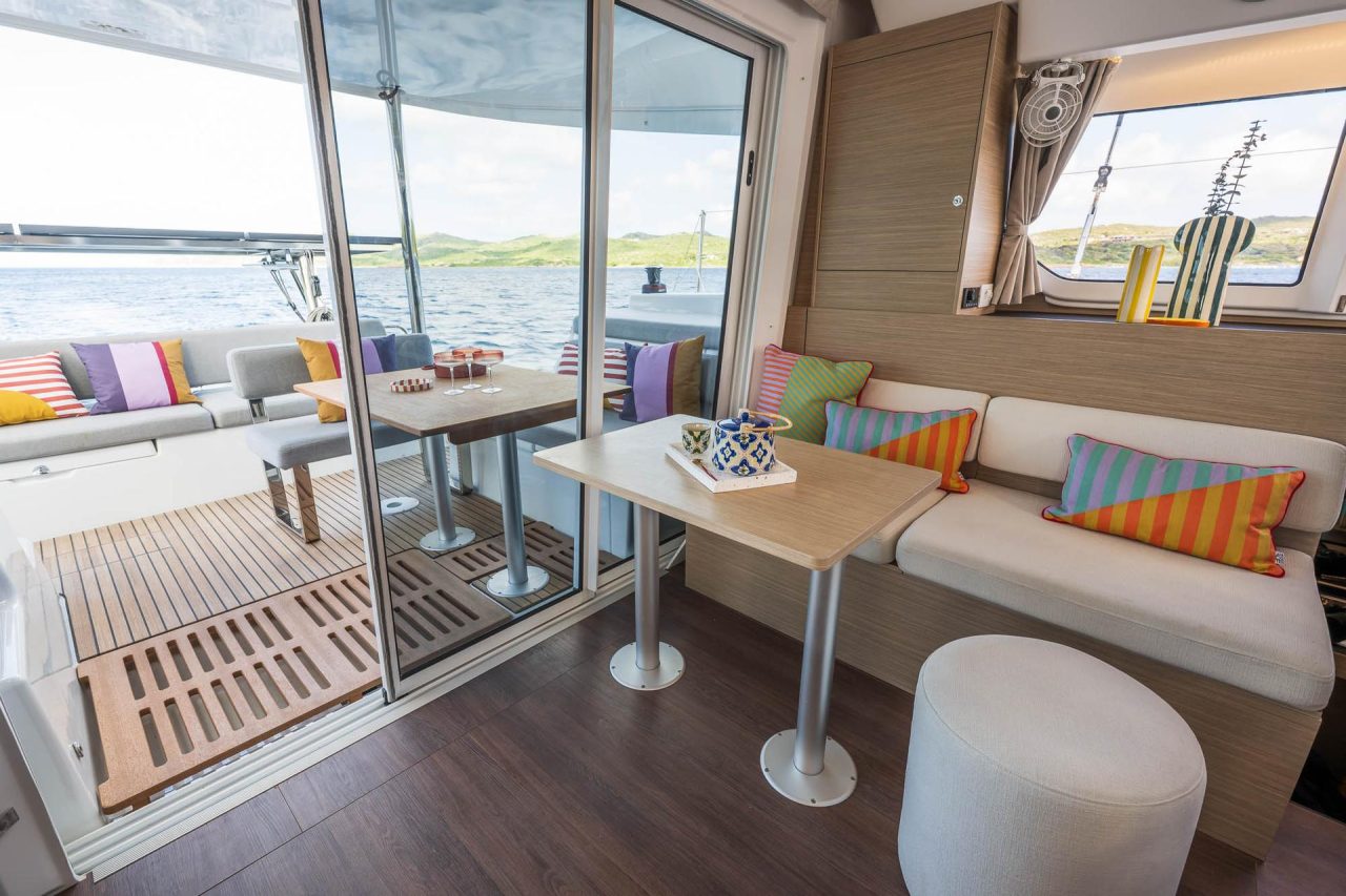Through view of the spacious salon and cockpit of the Lagoon 38 sailing catamaran