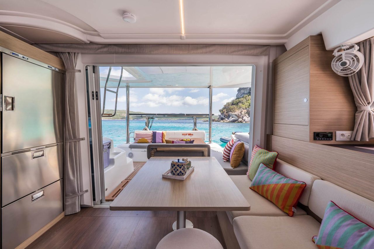 Interior of the Lagoon 38 sailing catamaran with the salon and kitchen