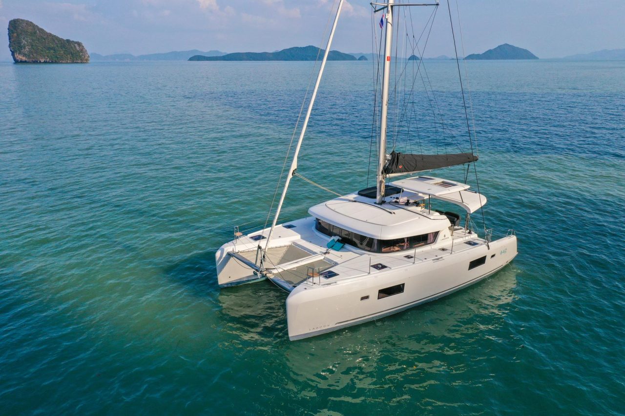 Lagoon 42 Millennium sailing catamaran at anchor near the Asian cliffs